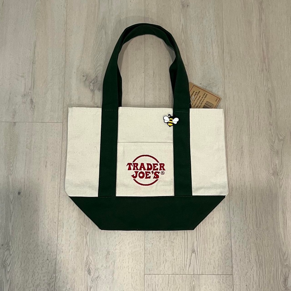 Trader Joe's mini canvas tote bag with green handle and trim red logo w/ bee pin